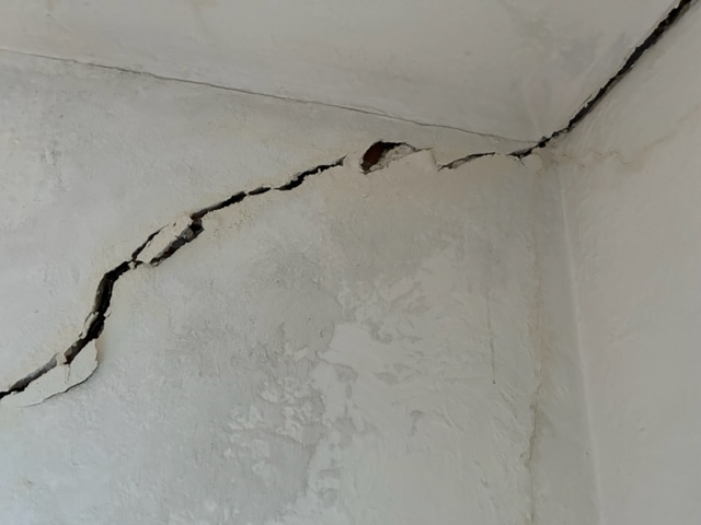 Numerous signs- Wall Crack Repair - Stratum Structural Systems